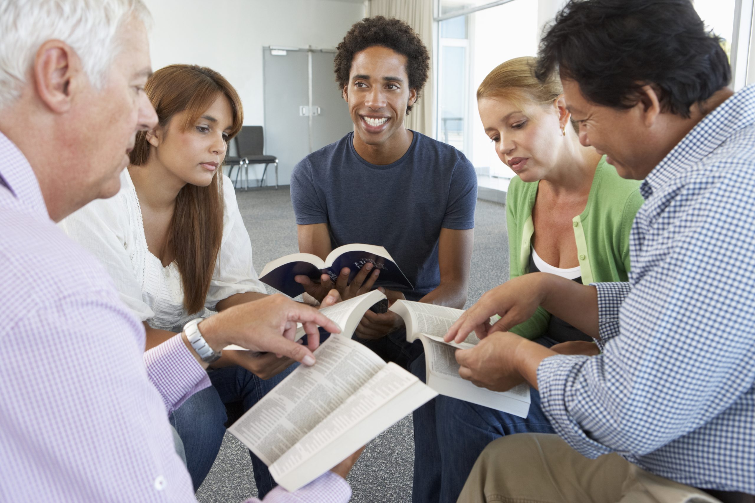 group of church members studying the Bible together